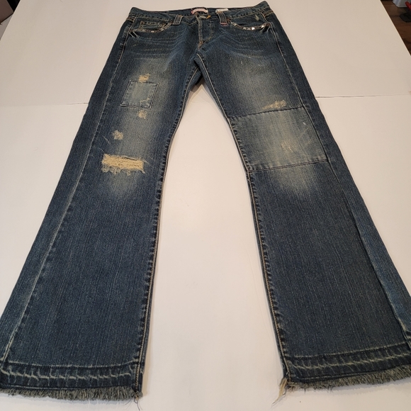Levi's Limited Edition Distressed Patched Embroidered Boot Cut Jean  Size 9 (34) - Picture 1 of 17